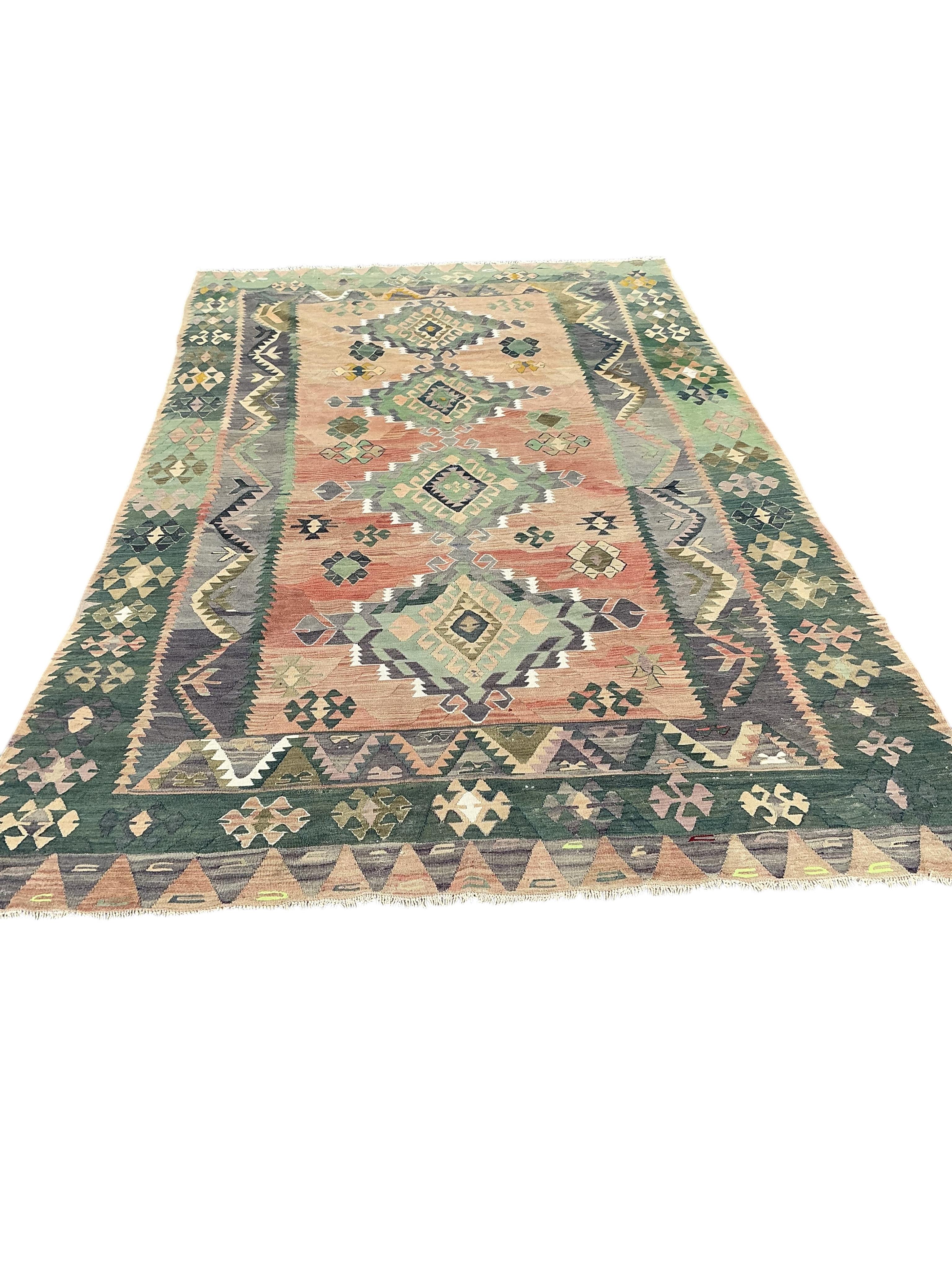 A Kelim polychrome medallion carpet, approximately 380 x 210cm